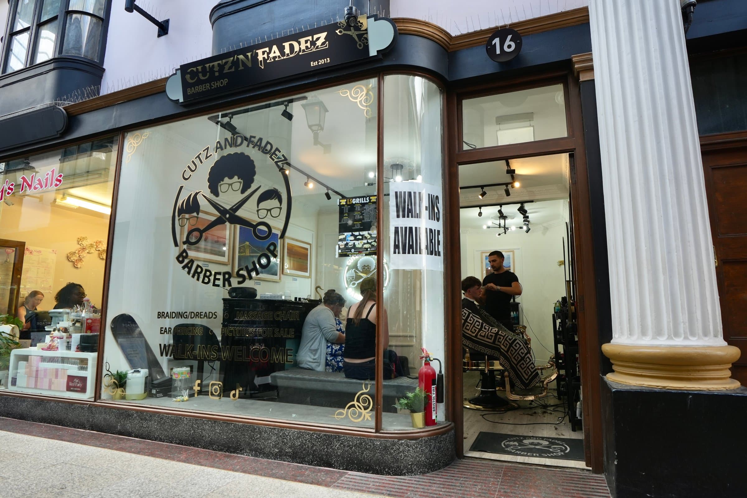 Cutz and Fadez shopfront in The Arcade, Bristol